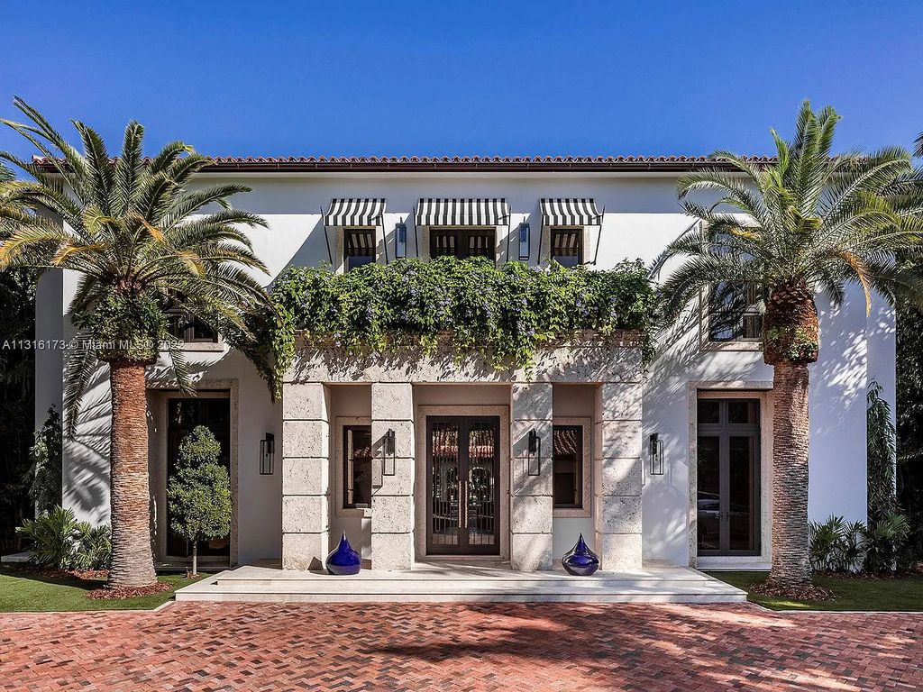 Located in 3541 Flamingo Drive, Miami Beach, Florida. This magnificent, newly constructed Mizner-inspired villa was tastefully designed as a contemporary redux with an unprecedented level of detail, influenced by owner-developer Oren Alexander. Enter the gated porte-cochère through the coach house, which features staff quarters and an A/C 2-car garage.