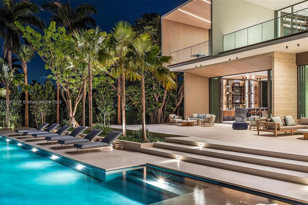 Located at 98 La Gorce Circle, Miami Beach, Florida, the extraordinary Villa Arte by Aquablue Group is situated on the exclusive La Gorce Island. The villa boasts astounding water features and an imposing entrance made of bronze, book-matched travertine, and Japanese white oak. Inside, the interior is unrivaled, featuring finishes in leather, marble, and luxurious wall coverings that have been handcrafted by Italian artisans.