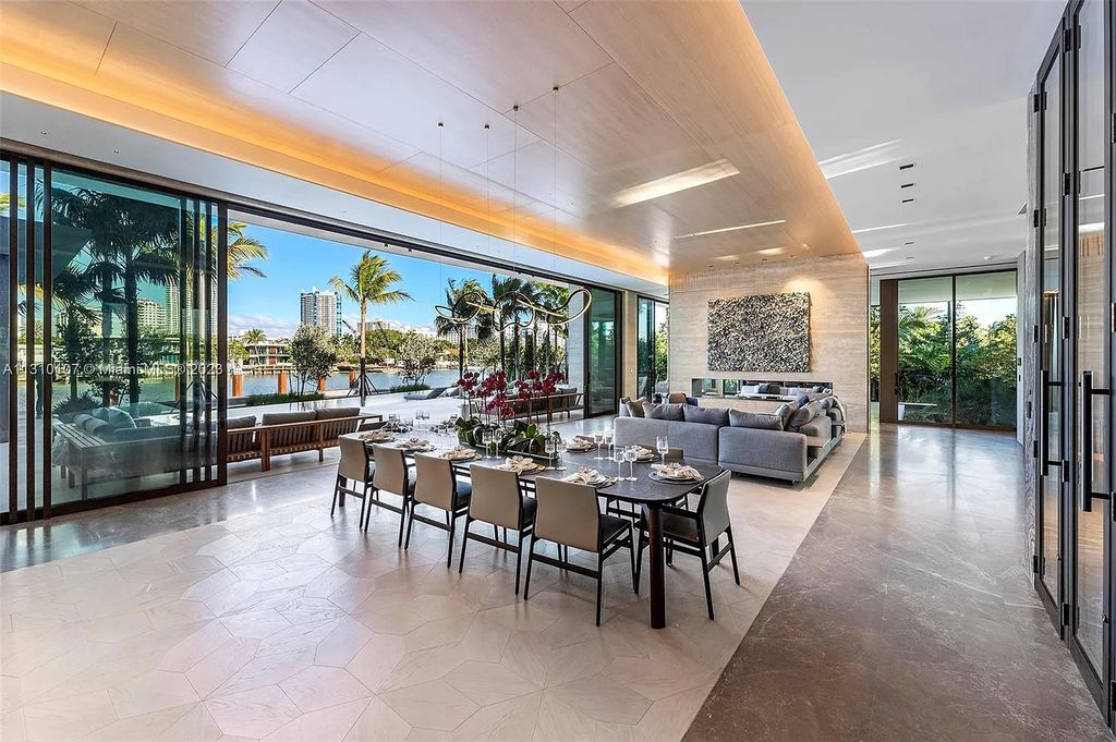 Located at 98 La Gorce Circle, Miami Beach, Florida, the extraordinary Villa Arte by Aquablue Group is situated on the exclusive La Gorce Island. The villa boasts astounding water features and an imposing entrance made of bronze, book-matched travertine, and Japanese white oak. Inside, the interior is unrivaled, featuring finishes in leather, marble, and luxurious wall coverings that have been handcrafted by Italian artisans.