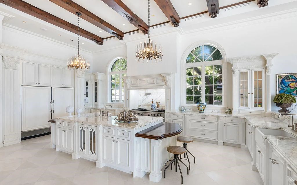 2325 S Ocean Blvd, Delray Beach, FL. A spectacular direct Oceanfront 9BR/13.7BA Estate, custom-built with commanding, unobstructed ocean views. The property boasts gorgeous detailing throughout, featuring palazzo-inspired compound, custom finishes, intricate marblework, and beautiful artisan millwork.