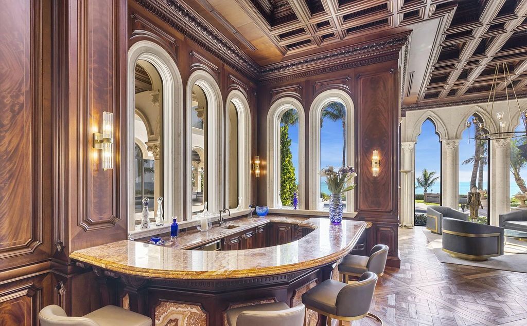 2325 S Ocean Blvd, Delray Beach, FL. A spectacular direct Oceanfront 9BR/13.7BA Estate, custom-built with commanding, unobstructed ocean views. The property boasts gorgeous detailing throughout, featuring palazzo-inspired compound, custom finishes, intricate marblework, and beautiful artisan millwork.