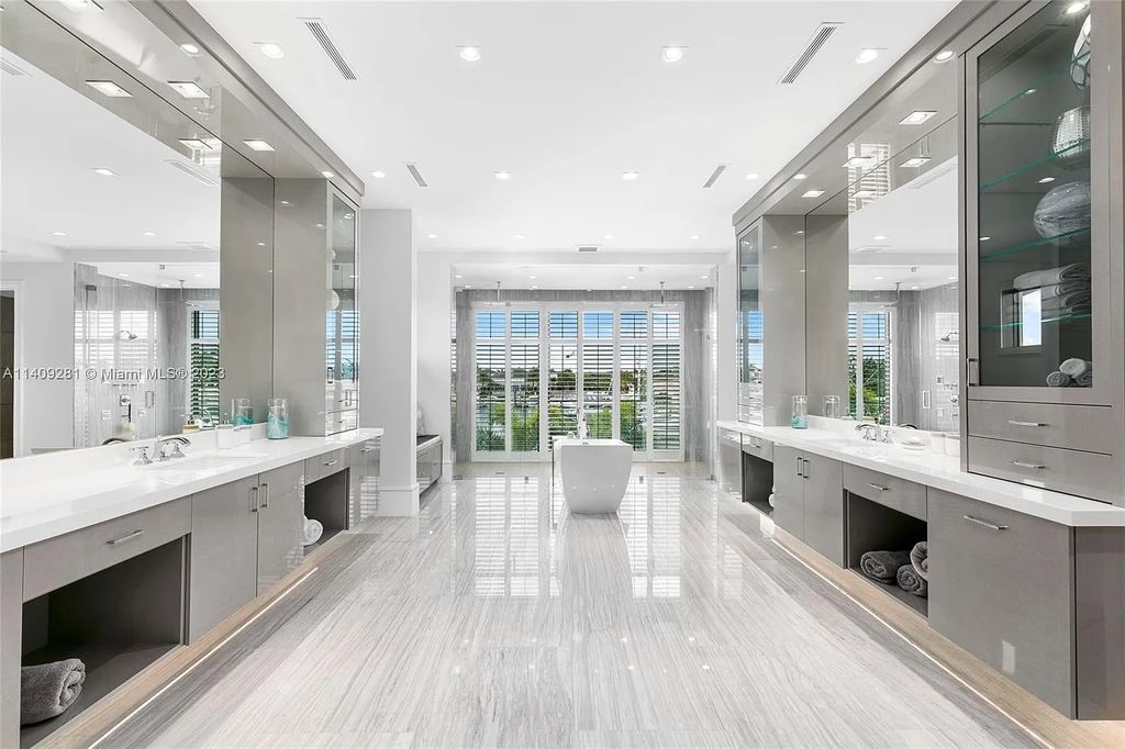 Welcome to 169 W. Key Palm Road in Boca Raton, a visionary display of architectural intrigue and soft contemporary design. The waterfront property is situated behind private gates in one of the most prominent residential communities in all of South Florida—Royal Palm Yacht & Country Club