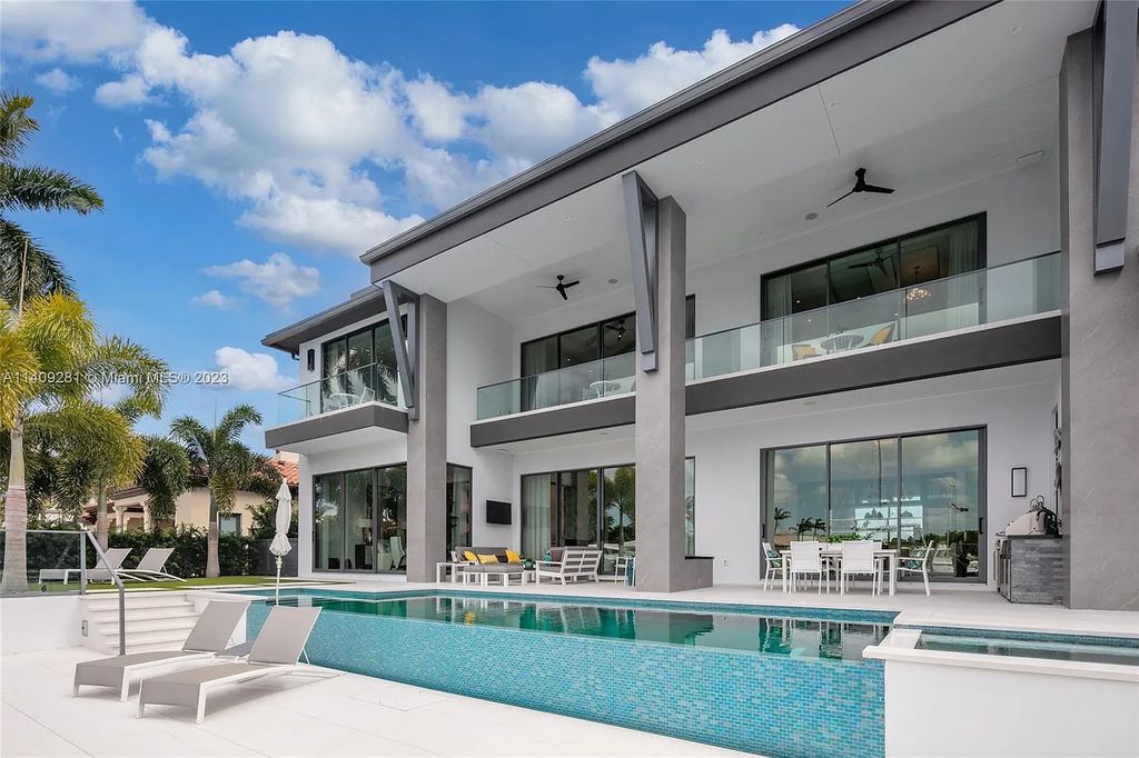 Welcome to 169 W. Key Palm Road in Boca Raton, a visionary display of architectural intrigue and soft contemporary design. The waterfront property is situated behind private gates in one of the most prominent residential communities in all of South Florida—Royal Palm Yacht & Country Club