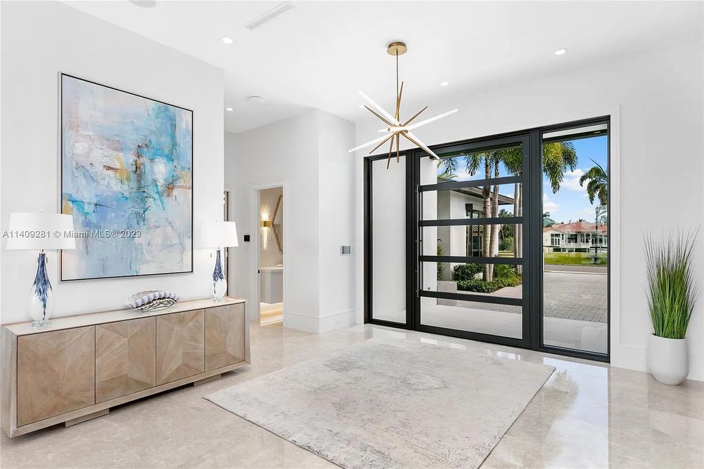 Welcome to 169 W. Key Palm Road in Boca Raton, a visionary display of architectural intrigue and soft contemporary design. The waterfront property is situated behind private gates in one of the most prominent residential communities in all of South Florida—Royal Palm Yacht & Country Club