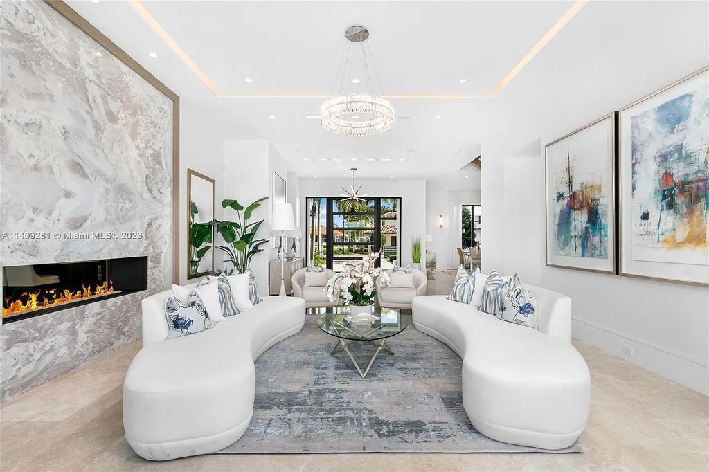 Welcome to 169 W. Key Palm Road in Boca Raton, a visionary display of architectural intrigue and soft contemporary design. The waterfront property is situated behind private gates in one of the most prominent residential communities in all of South Florida—Royal Palm Yacht & Country Club