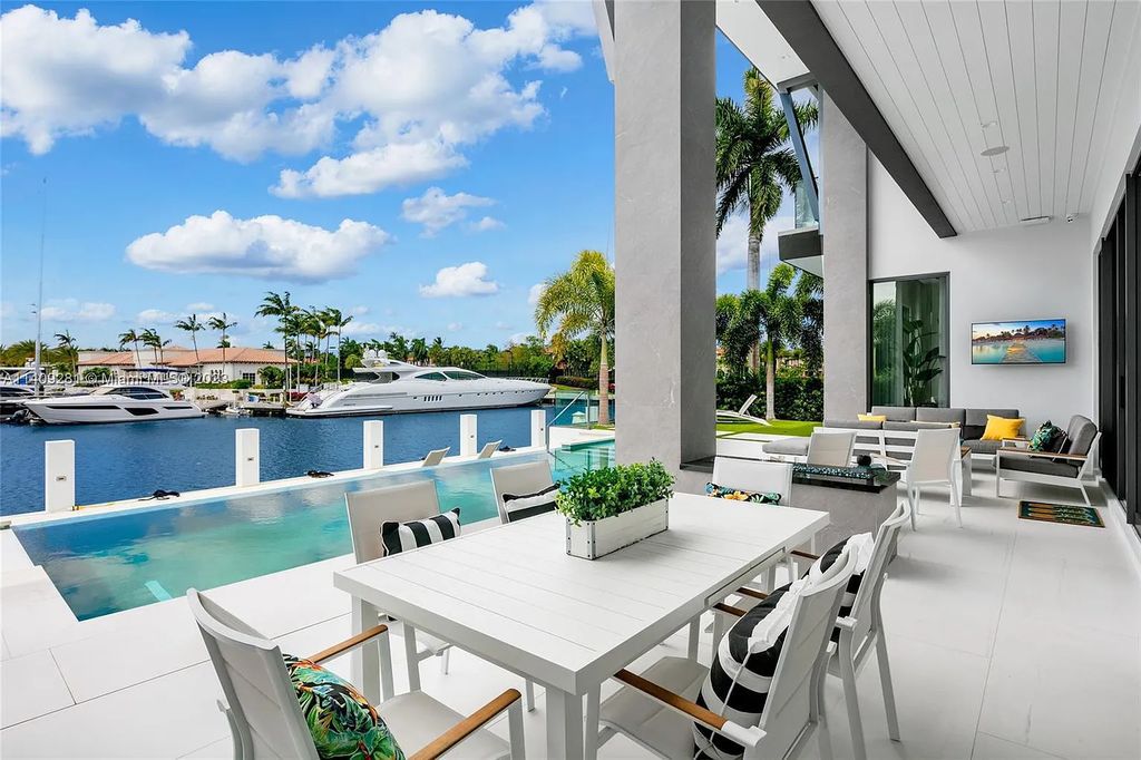 Welcome to 169 W. Key Palm Road in Boca Raton, a visionary display of architectural intrigue and soft contemporary design. The waterfront property is situated behind private gates in one of the most prominent residential communities in all of South Florida—Royal Palm Yacht & Country Club