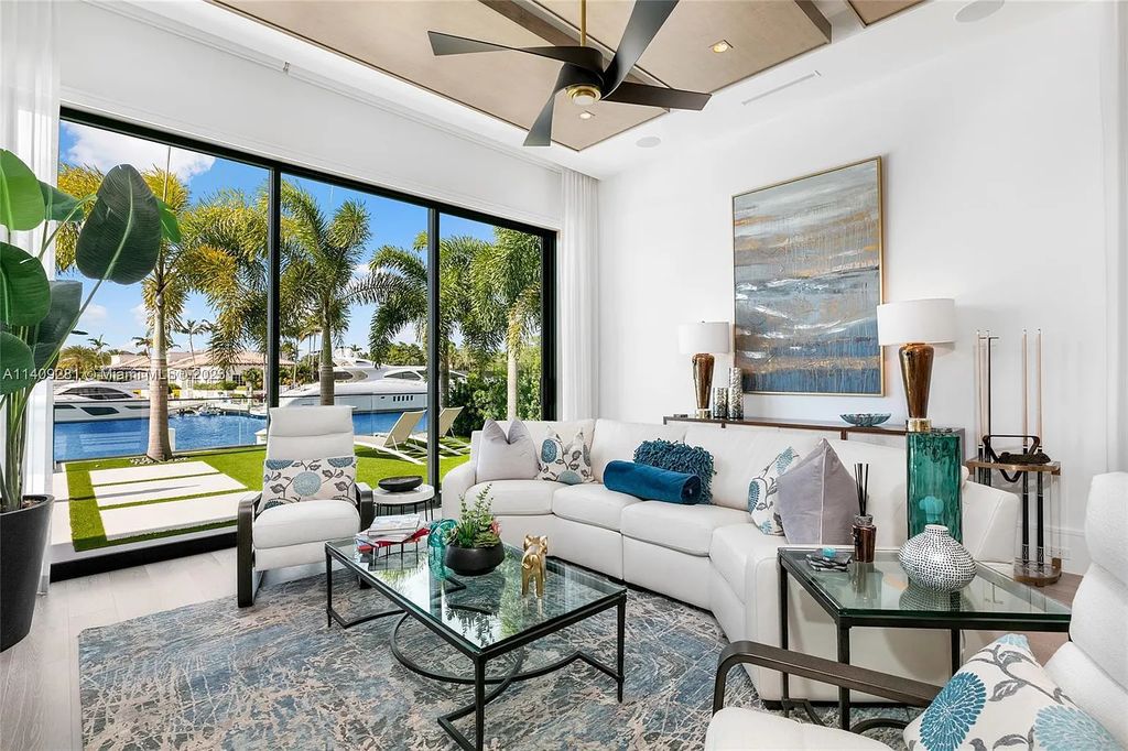 Welcome to 169 W. Key Palm Road in Boca Raton, a visionary display of architectural intrigue and soft contemporary design. The waterfront property is situated behind private gates in one of the most prominent residential communities in all of South Florida—Royal Palm Yacht & Country Club