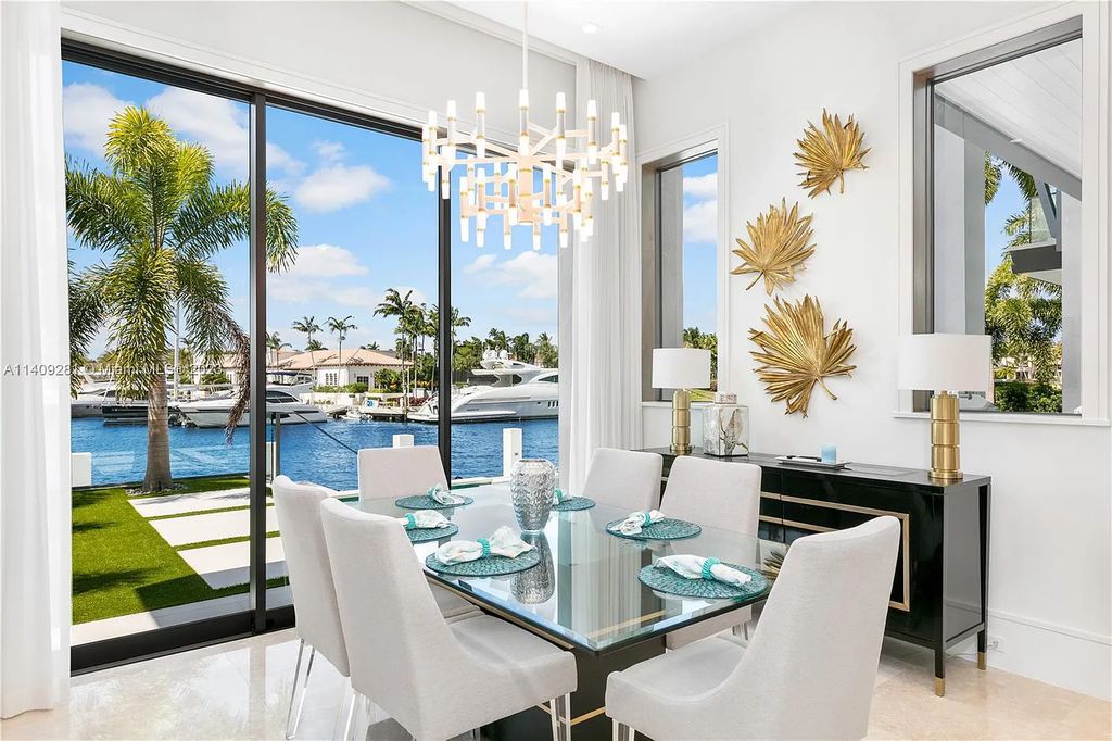 Welcome to 169 W. Key Palm Road in Boca Raton, a visionary display of architectural intrigue and soft contemporary design. The waterfront property is situated behind private gates in one of the most prominent residential communities in all of South Florida—Royal Palm Yacht & Country Club