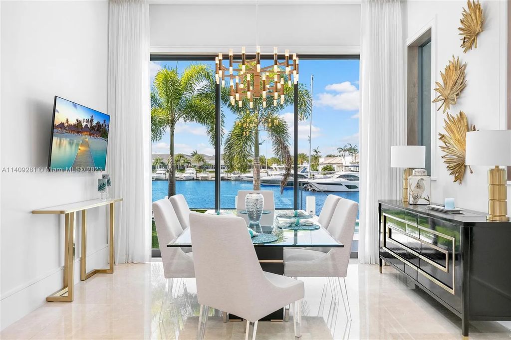 Welcome to 169 W. Key Palm Road in Boca Raton, a visionary display of architectural intrigue and soft contemporary design. The waterfront property is situated behind private gates in one of the most prominent residential communities in all of South Florida—Royal Palm Yacht & Country Club