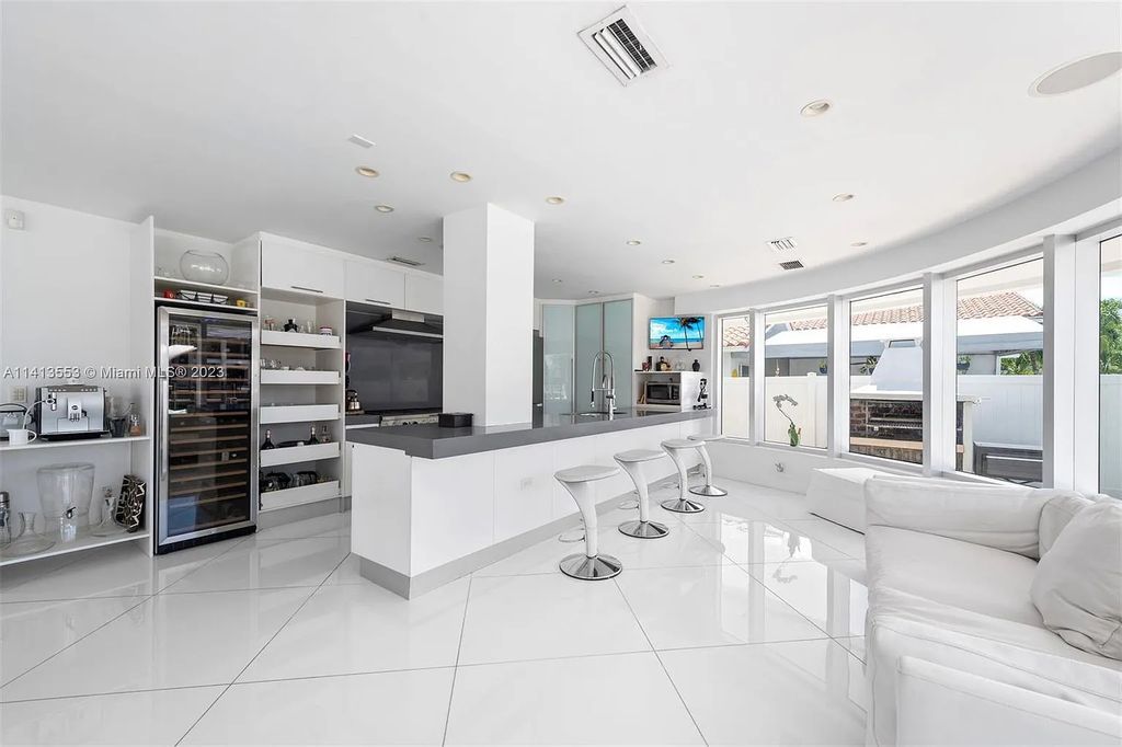 3344 NE 167th St, North Miami Beach, Florida. Sleekest, All Modern, Mint - Better than 2024 Design, BEST IN CLASS on the Market! 80 FT on Water with outfitted Dock for Ocean Access. Front Electric Gate and Elevator. Impact Windows, a NATURAL LIGHT MASTERPIECE