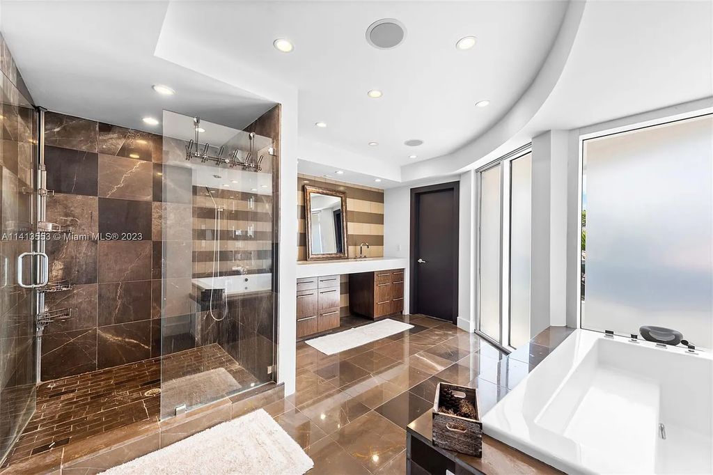 3344 NE 167th St, North Miami Beach, Florida. Sleekest, All Modern, Mint - Better than 2024 Design, BEST IN CLASS on the Market! 80 FT on Water with outfitted Dock for Ocean Access. Front Electric Gate and Elevator. Impact Windows, a NATURAL LIGHT MASTERPIECE