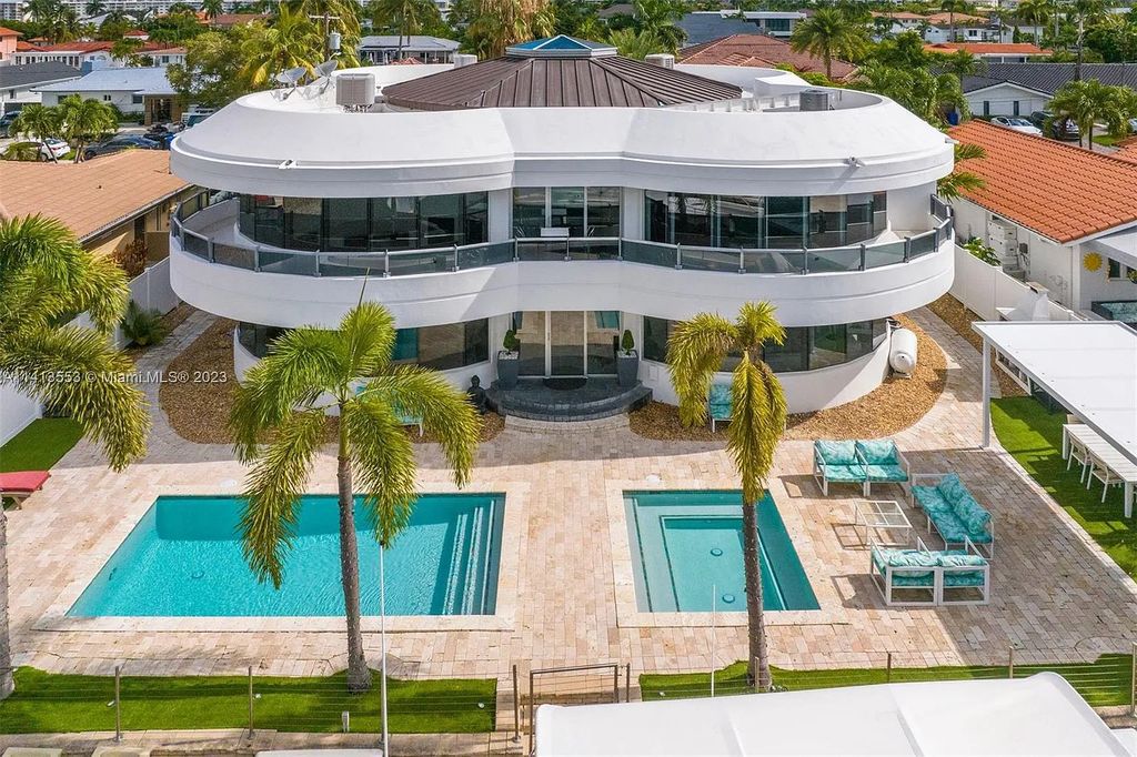 3344 NE 167th St, North Miami Beach, Florida. Sleekest, All Modern, Mint - Better than 2024 Design, BEST IN CLASS on the Market! 80 FT on Water with outfitted Dock for Ocean Access. Front Electric Gate and Elevator. Impact Windows, a NATURAL LIGHT MASTERPIECE