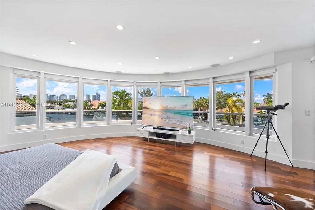 3344 NE 167th St, North Miami Beach, Florida. Sleekest, All Modern, Mint - Better than 2024 Design, BEST IN CLASS on the Market! 80 FT on Water with outfitted Dock for Ocean Access. Front Electric Gate and Elevator. Impact Windows, a NATURAL LIGHT MASTERPIECE