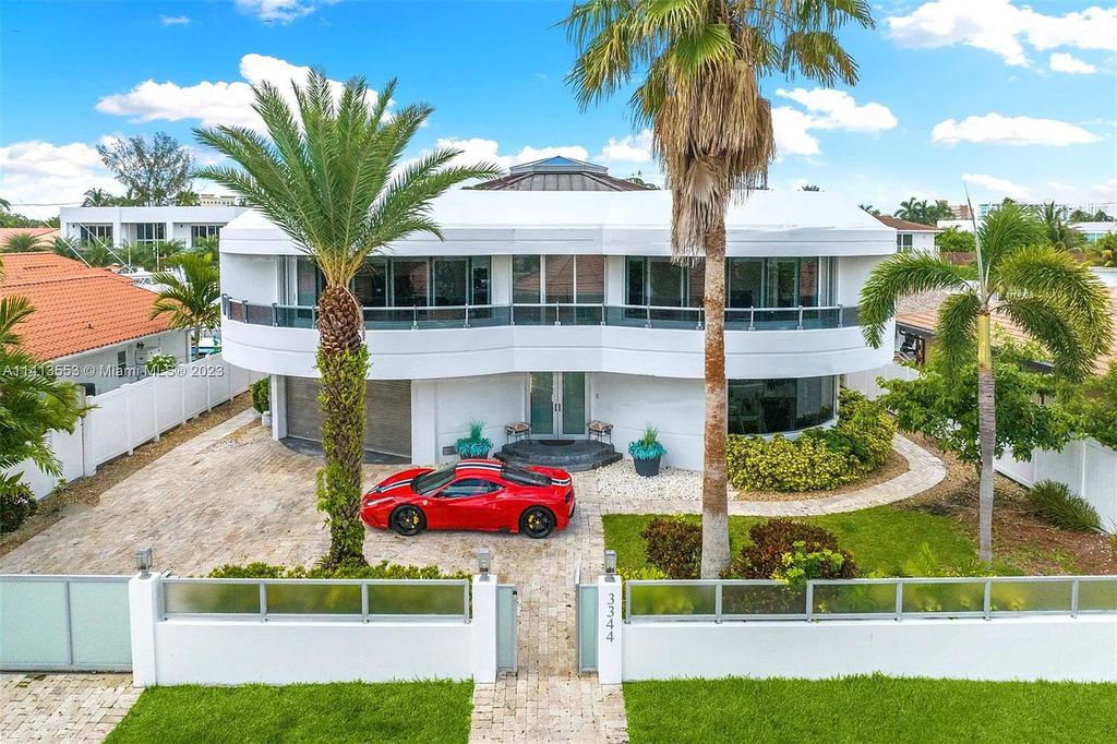 3344 NE 167th St, North Miami Beach, Florida. Sleekest, All Modern, Mint - Better than 2024 Design, BEST IN CLASS on the Market! 80 FT on Water with outfitted Dock for Ocean Access. Front Electric Gate and Elevator. Impact Windows, a NATURAL LIGHT MASTERPIECE