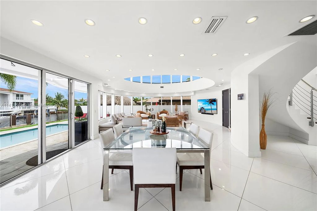 3344 NE 167th St, North Miami Beach, Florida. Sleekest, All Modern, Mint - Better than 2024 Design, BEST IN CLASS on the Market! 80 FT on Water with outfitted Dock for Ocean Access. Front Electric Gate and Elevator. Impact Windows, a NATURAL LIGHT MASTERPIECE