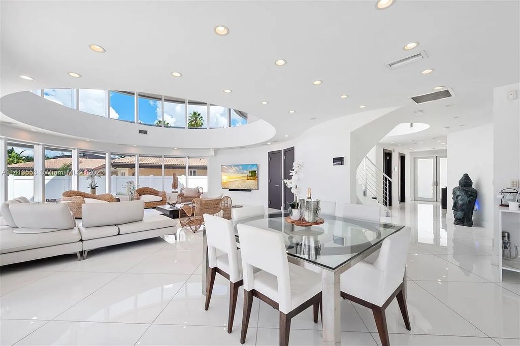 3344 NE 167th St, North Miami Beach, Florida. Sleekest, All Modern, Mint - Better than 2024 Design, BEST IN CLASS on the Market! 80 FT on Water with outfitted Dock for Ocean Access. Front Electric Gate and Elevator. Impact Windows, a NATURAL LIGHT MASTERPIECE