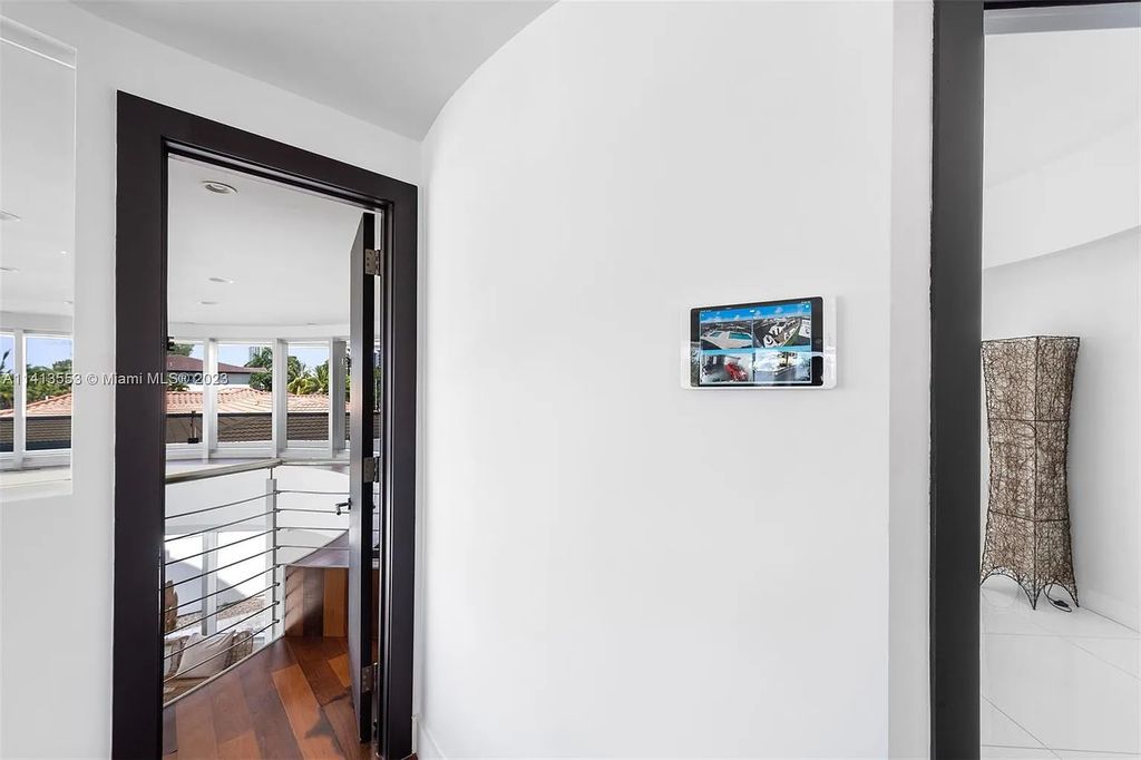 3344 NE 167th St, North Miami Beach, Florida. Sleekest, All Modern, Mint - Better than 2024 Design, BEST IN CLASS on the Market! 80 FT on Water with outfitted Dock for Ocean Access. Front Electric Gate and Elevator. Impact Windows, a NATURAL LIGHT MASTERPIECE