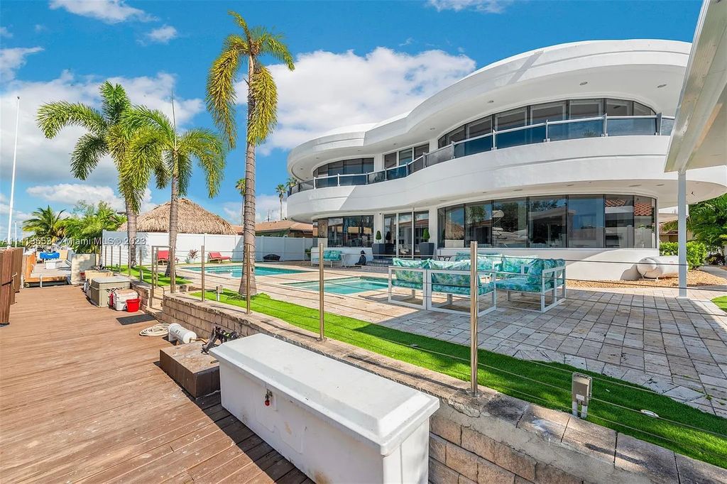 3344 NE 167th St, North Miami Beach, Florida. Sleekest, All Modern, Mint - Better than 2024 Design, BEST IN CLASS on the Market! 80 FT on Water with outfitted Dock for Ocean Access. Front Electric Gate and Elevator. Impact Windows, a NATURAL LIGHT MASTERPIECE