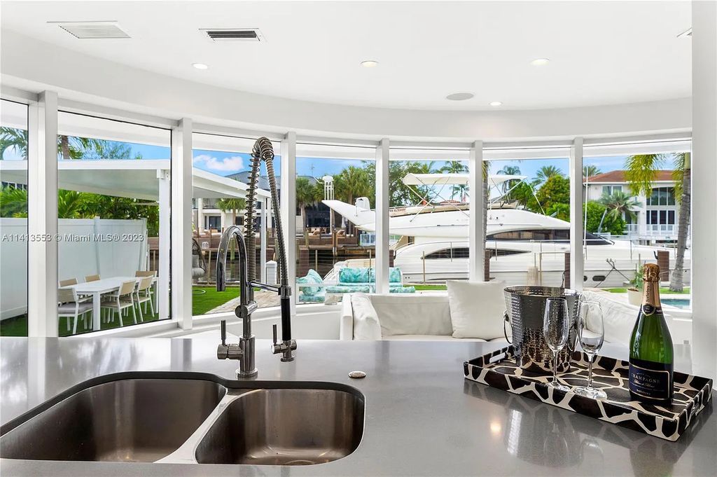 3344 NE 167th St, North Miami Beach, Florida. Sleekest, All Modern, Mint - Better than 2024 Design, BEST IN CLASS on the Market! 80 FT on Water with outfitted Dock for Ocean Access. Front Electric Gate and Elevator. Impact Windows, a NATURAL LIGHT MASTERPIECE