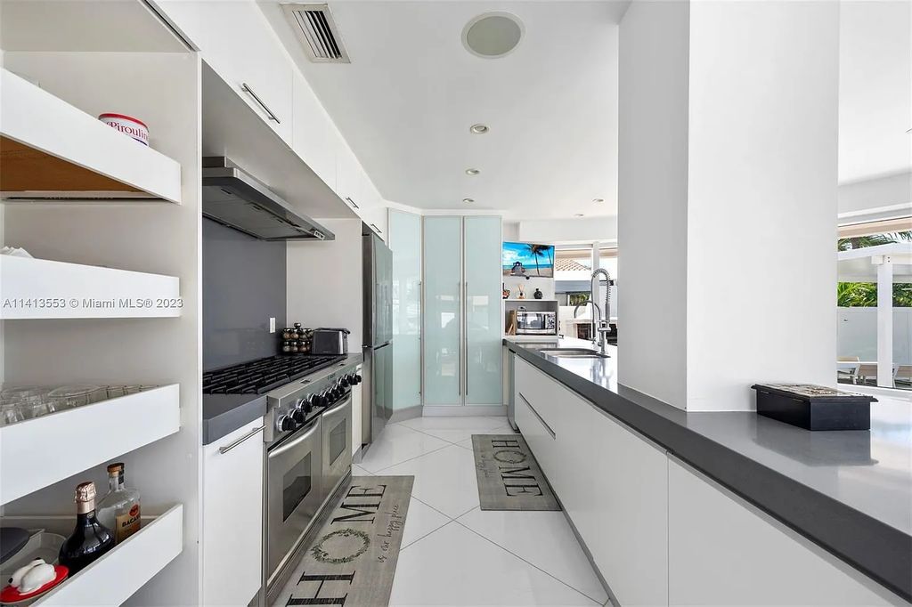 3344 NE 167th St, North Miami Beach, Florida. Sleekest, All Modern, Mint - Better than 2024 Design, BEST IN CLASS on the Market! 80 FT on Water with outfitted Dock for Ocean Access. Front Electric Gate and Elevator. Impact Windows, a NATURAL LIGHT MASTERPIECE