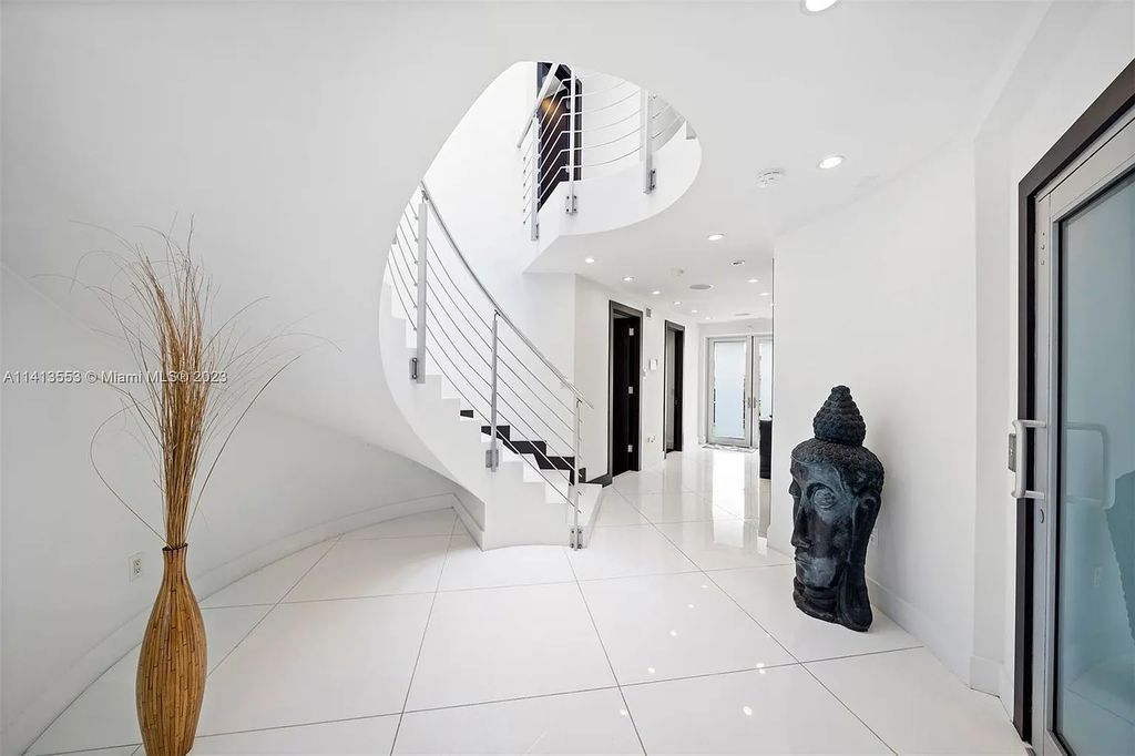 3344 NE 167th St, North Miami Beach, Florida. Sleekest, All Modern, Mint - Better than 2024 Design, BEST IN CLASS on the Market! 80 FT on Water with outfitted Dock for Ocean Access. Front Electric Gate and Elevator. Impact Windows, a NATURAL LIGHT MASTERPIECE