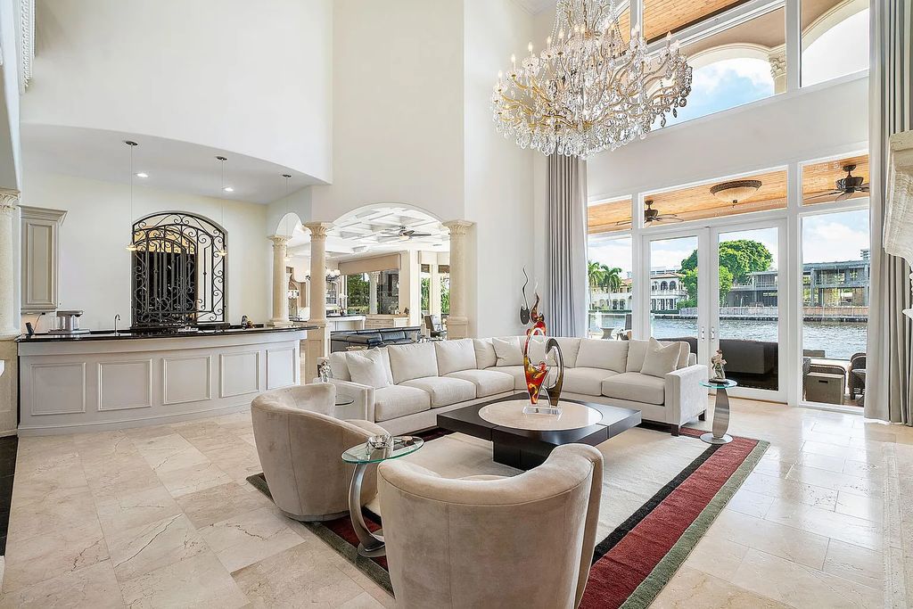 Live the ultimate waterfront dream at this exquisite estate in the prestigious Royal Palm Yacht & Country Club. With its private dock, resort-style pool, and awe-inspiring vistas, this 5-bedroom home offers the perfect blend of luxury and serenity.