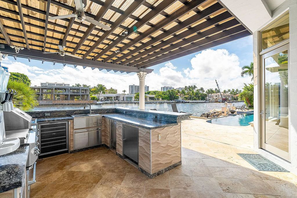 Live the ultimate waterfront dream at this exquisite estate in the prestigious Royal Palm Yacht & Country Club. With its private dock, resort-style pool, and awe-inspiring vistas, this 5-bedroom home offers the perfect blend of luxury and serenity.