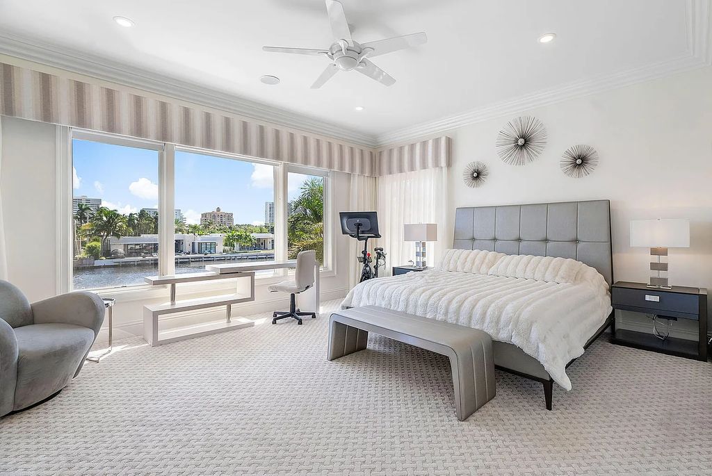 Live the ultimate waterfront dream at this exquisite estate in the prestigious Royal Palm Yacht & Country Club. With its private dock, resort-style pool, and awe-inspiring vistas, this 5-bedroom home offers the perfect blend of luxury and serenity.