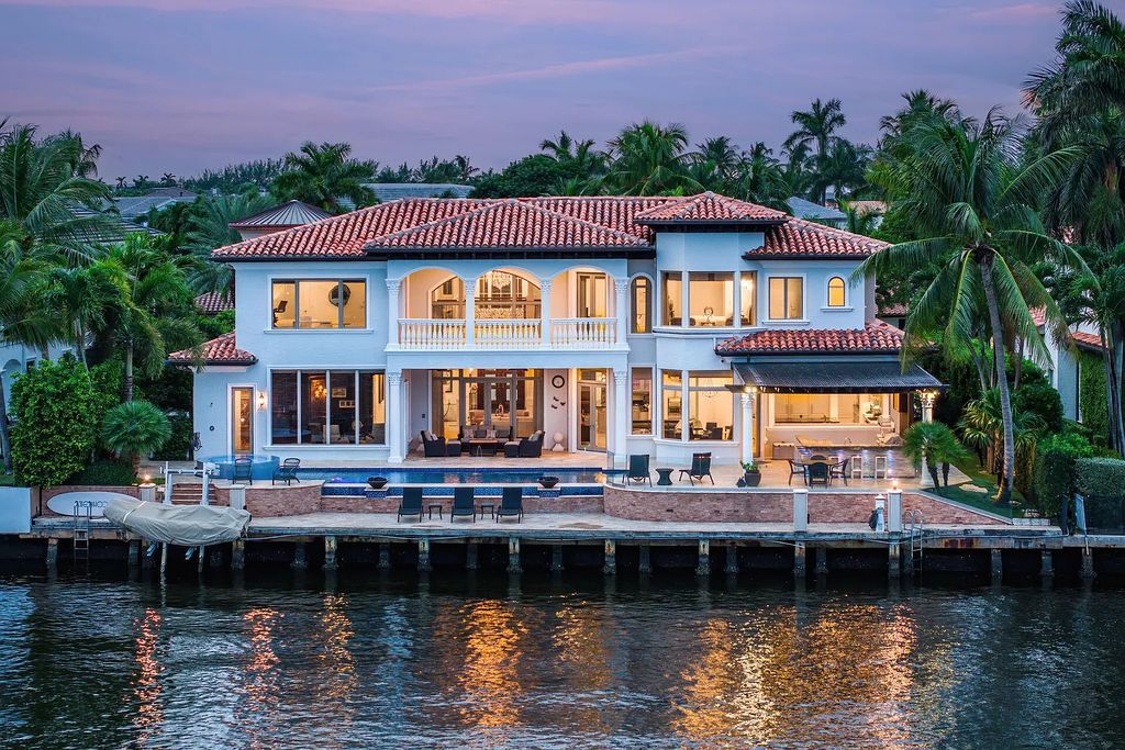 Live the ultimate waterfront dream at this exquisite estate in the prestigious Royal Palm Yacht & Country Club. With its private dock, resort-style pool, and awe-inspiring vistas, this 5-bedroom home offers the perfect blend of luxury and serenity.