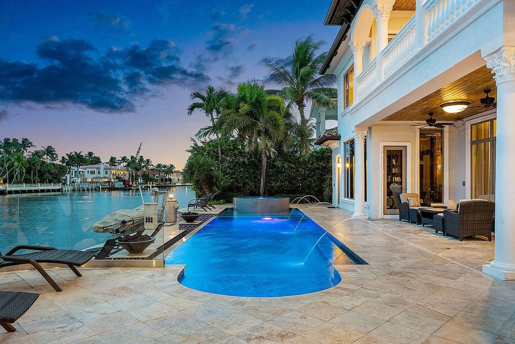 Live the ultimate waterfront dream at this exquisite estate in the prestigious Royal Palm Yacht & Country Club. With its private dock, resort-style pool, and awe-inspiring vistas, this 5-bedroom home offers the perfect blend of luxury and serenity.