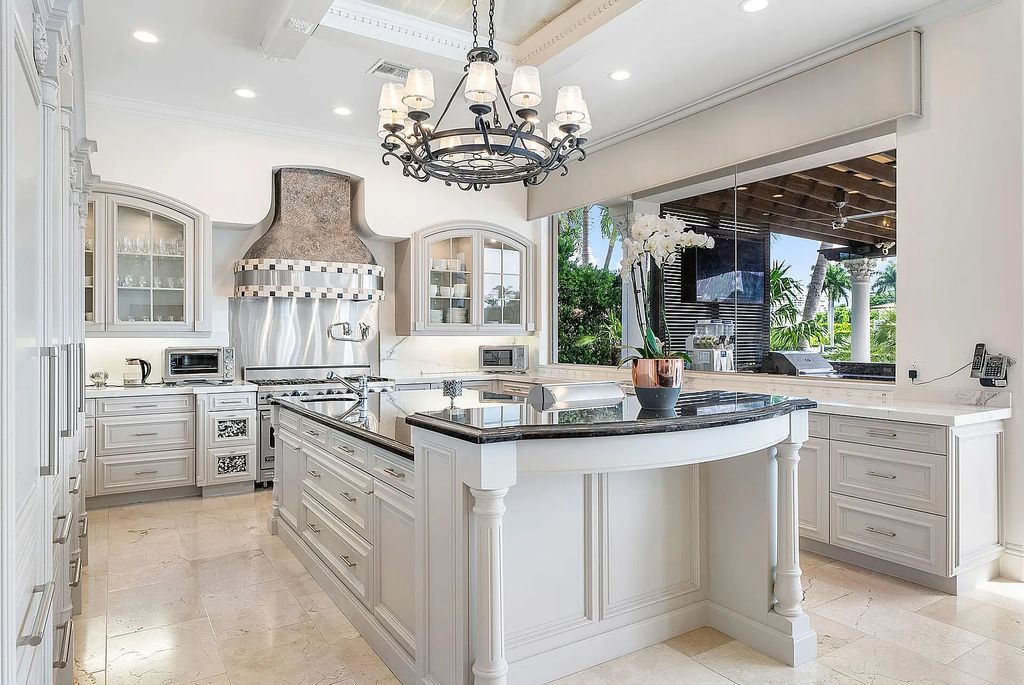 Live the ultimate waterfront dream at this exquisite estate in the prestigious Royal Palm Yacht & Country Club. With its private dock, resort-style pool, and awe-inspiring vistas, this 5-bedroom home offers the perfect blend of luxury and serenity.