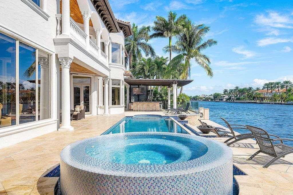 Live the ultimate waterfront dream at this exquisite estate in the prestigious Royal Palm Yacht & Country Club. With its private dock, resort-style pool, and awe-inspiring vistas, this 5-bedroom home offers the perfect blend of luxury and serenity.