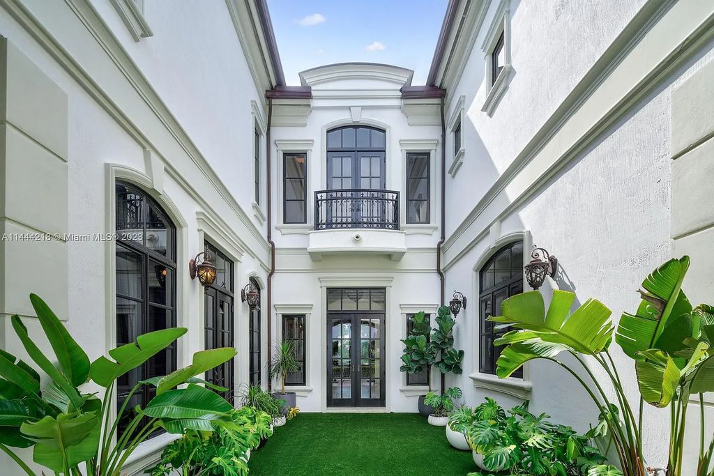 This architectural masterpiece, designed by famed architect Ramon Pacheco and remodeled in 2015, offers modern luxury living in the highly coveted & gated Coral Gables community of Old Cutler Bay. The grand foyer, sweeping staircase, and soaring ceilings welcome an abundance of natural light and elegance. Complete with an infinity-edge pool, plenty of covered terraces, and beautiful water views.