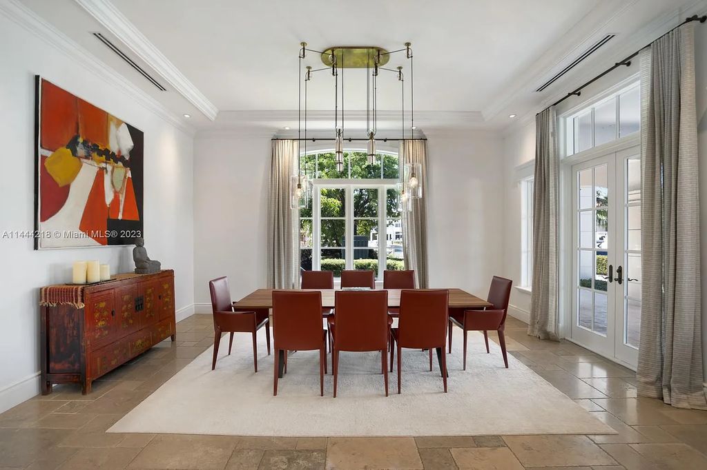 This architectural masterpiece, designed by famed architect Ramon Pacheco and remodeled in 2015, offers modern luxury living in the highly coveted & gated Coral Gables community of Old Cutler Bay. The grand foyer, sweeping staircase, and soaring ceilings welcome an abundance of natural light and elegance. Complete with an infinity-edge pool, plenty of covered terraces, and beautiful water views.