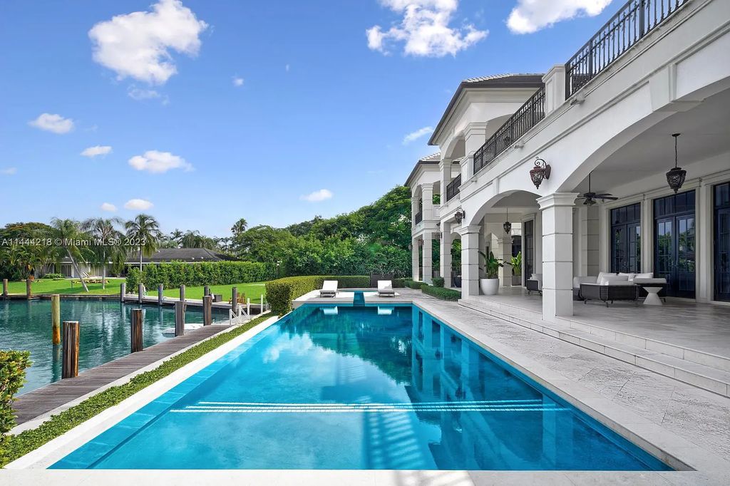 This architectural masterpiece, designed by famed architect Ramon Pacheco and remodeled in 2015, offers modern luxury living in the highly coveted & gated Coral Gables community of Old Cutler Bay. The grand foyer, sweeping staircase, and soaring ceilings welcome an abundance of natural light and elegance. Complete with an infinity-edge pool, plenty of covered terraces, and beautiful water views.