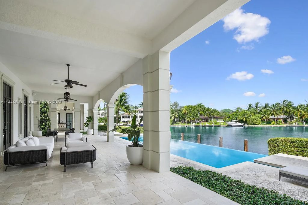 This architectural masterpiece, designed by famed architect Ramon Pacheco and remodeled in 2015, offers modern luxury living in the highly coveted & gated Coral Gables community of Old Cutler Bay. The grand foyer, sweeping staircase, and soaring ceilings welcome an abundance of natural light and elegance. Complete with an infinity-edge pool, plenty of covered terraces, and beautiful water views.