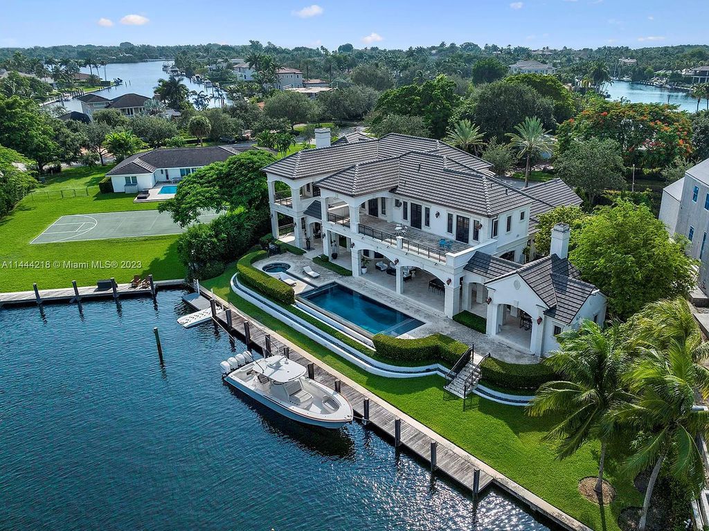 This architectural masterpiece, designed by famed architect Ramon Pacheco and remodeled in 2015, offers modern luxury living in the highly coveted & gated Coral Gables community of Old Cutler Bay. The grand foyer, sweeping staircase, and soaring ceilings welcome an abundance of natural light and elegance. Complete with an infinity-edge pool, plenty of covered terraces, and beautiful water views.