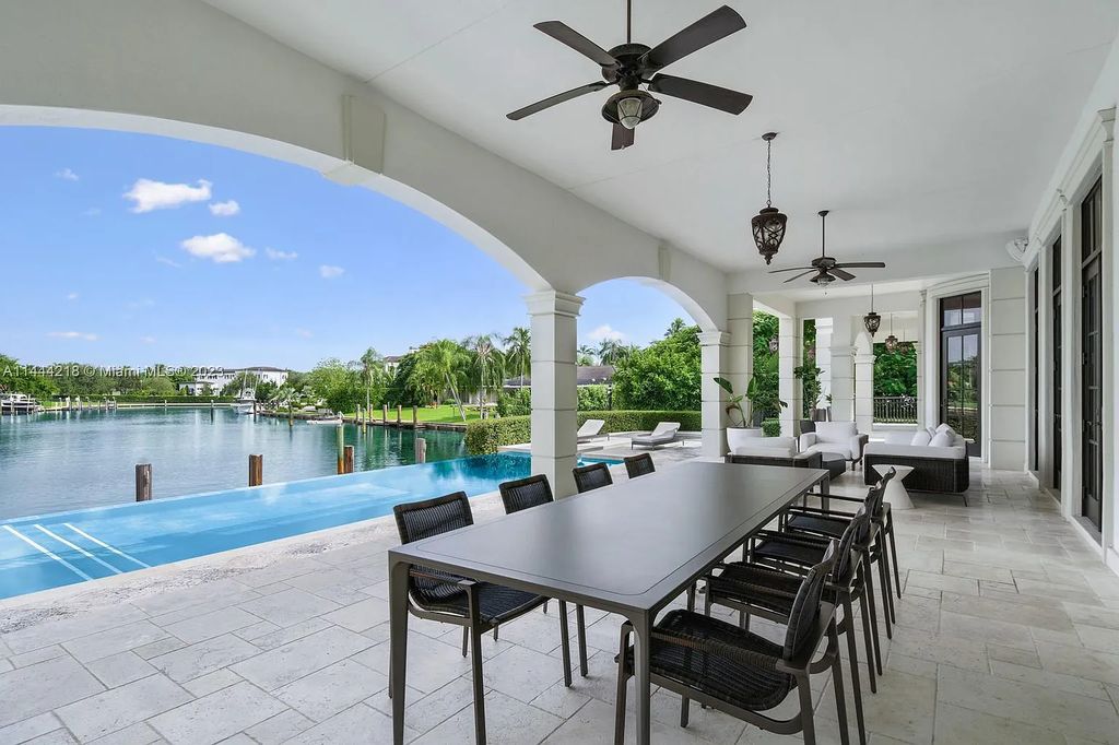 This architectural masterpiece, designed by famed architect Ramon Pacheco and remodeled in 2015, offers modern luxury living in the highly coveted & gated Coral Gables community of Old Cutler Bay. The grand foyer, sweeping staircase, and soaring ceilings welcome an abundance of natural light and elegance. Complete with an infinity-edge pool, plenty of covered terraces, and beautiful water views.