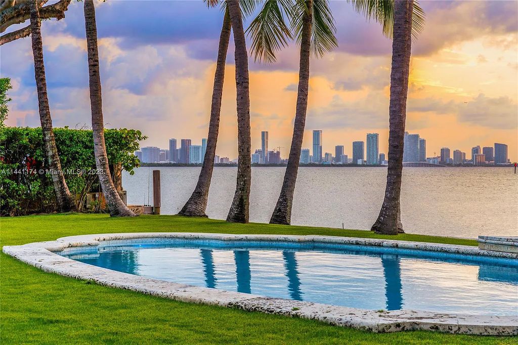 Fully renovated 8-bedroom, 8.5-bathroom estate on prestigious North Bay Road. Enjoy spectacular views of Downtown Miami and Biscayne Bay from the manicured grounds, complete with a private dock, pool, hot tub, cold plunge, summer kitchen, inviting driveway, and abundant courtyards. Boaters welcome with 139 feet on the water.