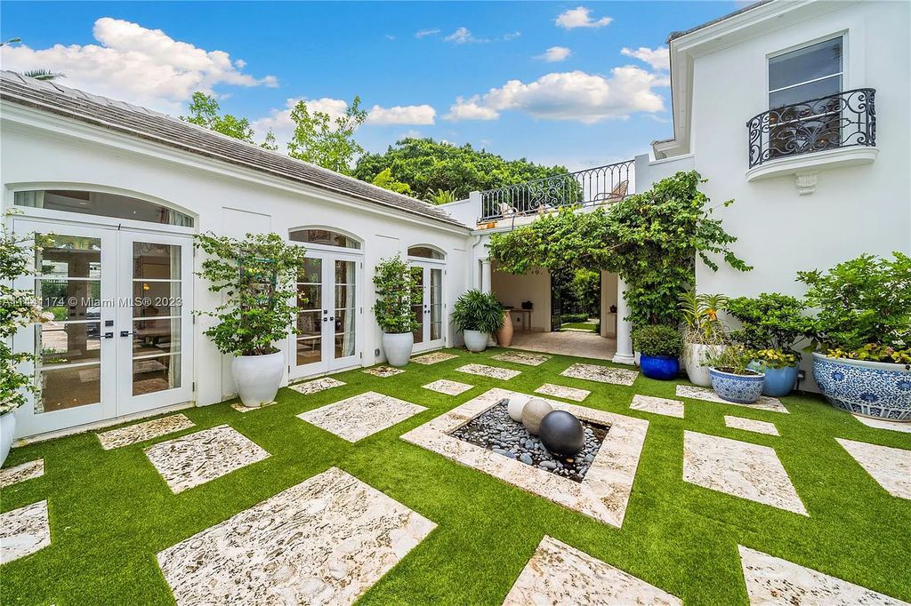 Fully renovated 8-bedroom, 8.5-bathroom estate on prestigious North Bay Road. Enjoy spectacular views of Downtown Miami and Biscayne Bay from the manicured grounds, complete with a private dock, pool, hot tub, cold plunge, summer kitchen, inviting driveway, and abundant courtyards. Boaters welcome with 139 feet on the water.