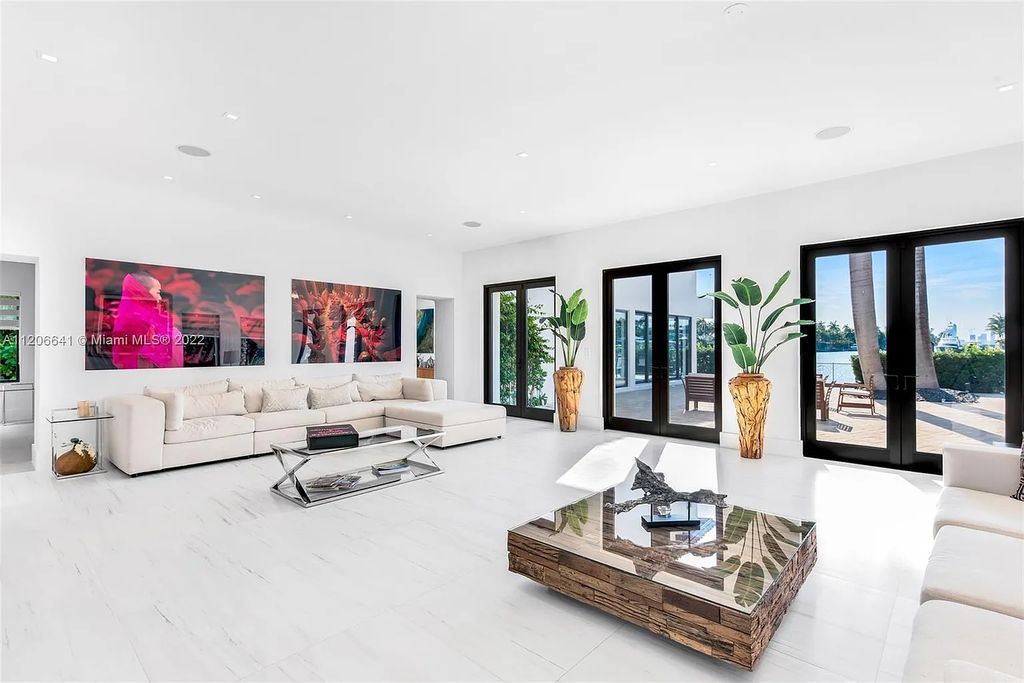 This 10,114 SF estate boasts an enviable sophisticated lifestyle complete with a guesthouse, 3-parking garages, gym, office, master suite with balcony, and more!