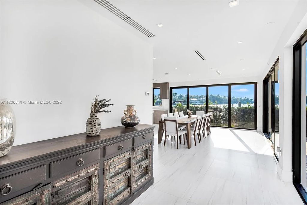 This 10,114 SF estate boasts an enviable sophisticated lifestyle complete with a guesthouse, 3-parking garages, gym, office, master suite with balcony, and more!