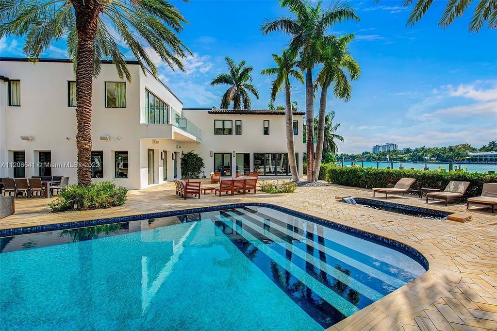 This 10,114 SF estate boasts an enviable sophisticated lifestyle complete with a guesthouse, 3-parking garages, gym, office, master suite with balcony, and more!