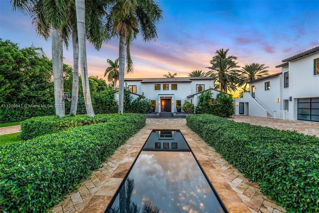 This 10,114 SF estate boasts an enviable sophisticated lifestyle complete with a guesthouse, 3-parking garages, gym, office, master suite with balcony, and more!