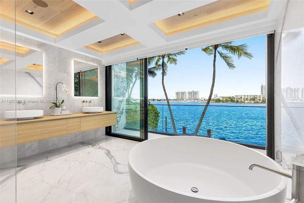 Experience sheer bliss in this contemporary masterpiece on the Venetian Islands. Completed in 2021, this waterfront estate features exquisite details, including vibrant marbles, a spacious open-plan living area, a stylish cocktail bar, and a chef's dream kitchen.