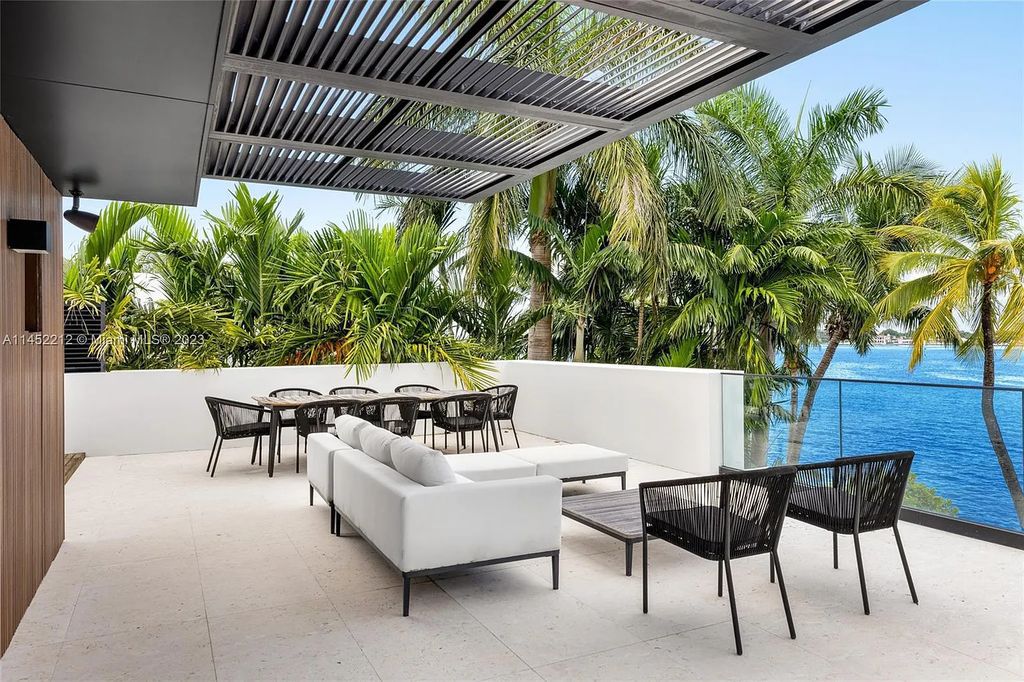 Experience sheer bliss in this contemporary masterpiece on the Venetian Islands. Completed in 2021, this waterfront estate features exquisite details, including vibrant marbles, a spacious open-plan living area, a stylish cocktail bar, and a chef's dream kitchen.