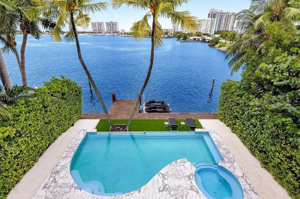 Experience sheer bliss in this contemporary masterpiece on the Venetian Islands. Completed in 2021, this waterfront estate features exquisite details, including vibrant marbles, a spacious open-plan living area, a stylish cocktail bar, and a chef's dream kitchen.