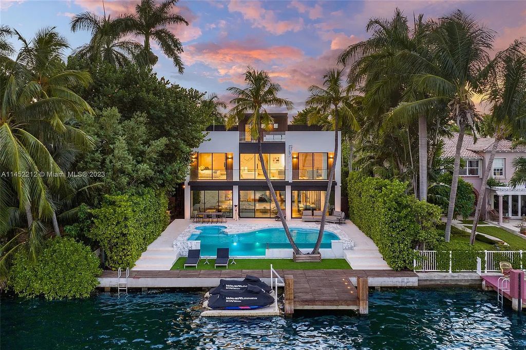 Experience sheer bliss in this contemporary masterpiece on the Venetian Islands. Completed in 2021, this waterfront estate features exquisite details, including vibrant marbles, a spacious open-plan living area, a stylish cocktail bar, and a chef's dream kitchen.