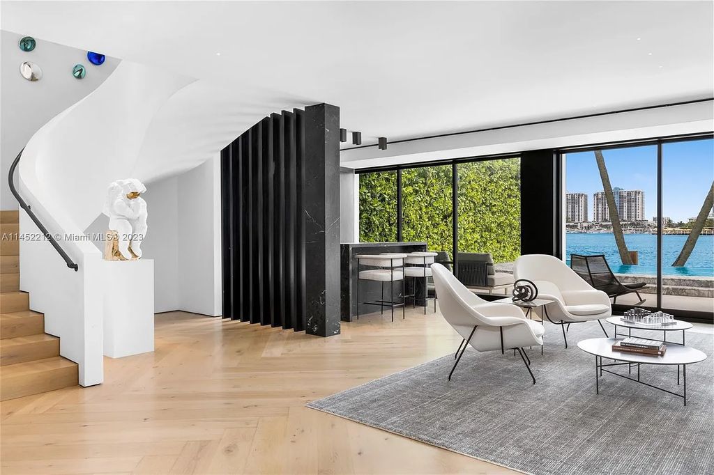 Experience sheer bliss in this contemporary masterpiece on the Venetian Islands. Completed in 2021, this waterfront estate features exquisite details, including vibrant marbles, a spacious open-plan living area, a stylish cocktail bar, and a chef's dream kitchen.