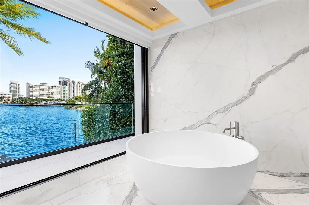 Experience sheer bliss in this contemporary masterpiece on the Venetian Islands. Completed in 2021, this waterfront estate features exquisite details, including vibrant marbles, a spacious open-plan living area, a stylish cocktail bar, and a chef's dream kitchen.